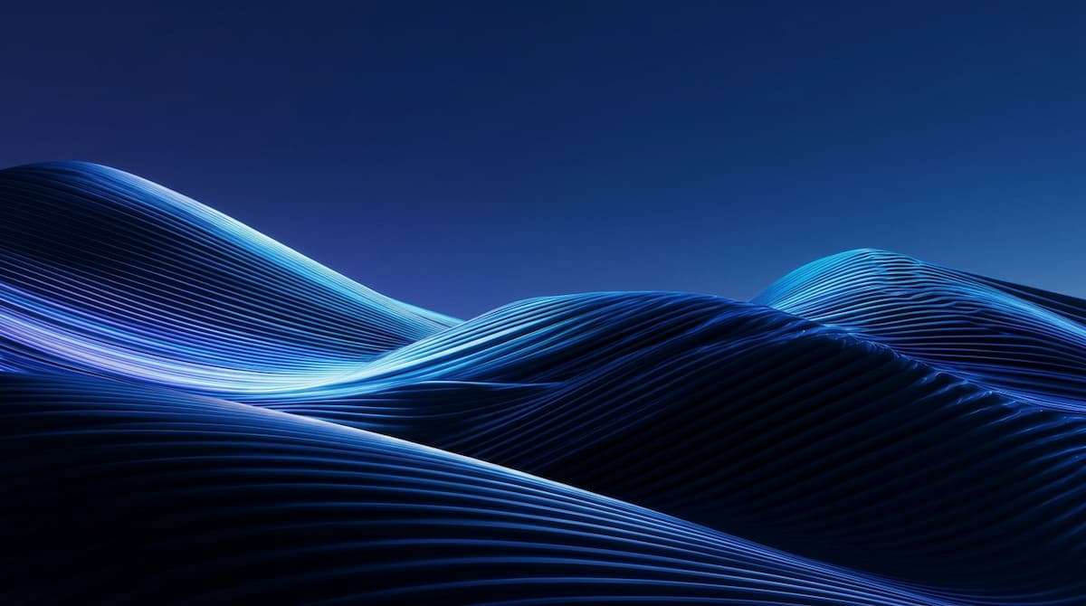 Abstract blue wave structure showing how organizational complexity accumulates over time and creates hidden coordination cost across the business