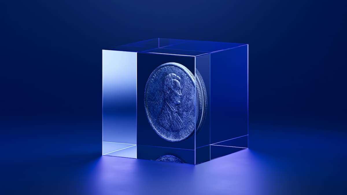 Coin held inside a transparent cube representing ecommerce platform payout delays and restricted cash flow